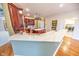 Kitchen with island, quartz countertops, and hardwood floors at 808 Copperfield Xing, Danville, IN 46122