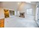 Vaulted ceiling living room with fireplace and access to deck at 808 Copperfield Xing, Danville, IN 46122