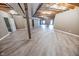 Unfinished basement with exposed beams and wood flooring at 808 Copperfield Xing, Danville, IN 46122