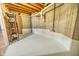 Unfinished basement with exposed beams and wood flooring at 808 Copperfield Xing, Danville, IN 46122