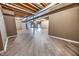 Unfinished basement with exposed beams and wood flooring at 808 Copperfield Xing, Danville, IN 46122