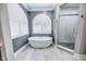 Bathroom with tub, shower and gray walls at 808 Copperfield Xing, Danville, IN 46122