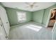 Bedroom with carpet flooring, window, and ceiling fan at 808 Copperfield Xing, Danville, IN 46122