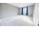 Bright bedroom with carpet flooring, window, and ceiling fan at 808 Copperfield Xing, Danville, IN 46122