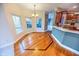 Octagonal dining room with hardwood floors and bay window at 808 Copperfield Xing, Danville, IN 46122