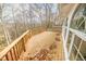Deck with wooden railings offering a view of the surrounding woods at 808 Copperfield Xing, Danville, IN 46122