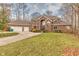Brick house with two car garage and autumn landscaping at 808 Copperfield Xing, Danville, IN 46122