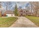 Two-story brick home with a driveway and basketball hoop at 808 Copperfield Xing, Danville, IN 46122