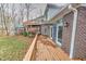 Deck overlooking a wooded backyard and retaining wall at 808 Copperfield Xing, Danville, IN 46122