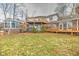 Back of house showing deck, hot tub, and sunroom at 808 Copperfield Xing, Danville, IN 46122