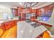 Upscale kitchen with an island cooktop, double wall ovens, and custom cabinetry at 808 Copperfield Xing, Danville, IN 46122