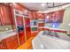Spacious kitchen with double ovens, a large island, and rich wood cabinets at 808 Copperfield Xing, Danville, IN 46122
