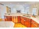 Kitchen features double sinks, a large island and views to Gathering room at 808 Copperfield Xing, Danville, IN 46122