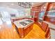 Open kitchen with large island, stainless steel appliances, and hardwood floors at 808 Copperfield Xing, Danville, IN 46122