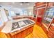 Island kitchen with cooktop and a view into the Gathering room at 808 Copperfield Xing, Danville, IN 46122
