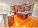 Spacious kitchen with island, stainless steel appliances, and hardwood floors at 808 Copperfield Xing, Danville, IN 46122