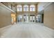 Spacious living room with high ceilings, large windows, and hardwood floors at 808 Copperfield Xing, Danville, IN 46122