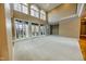 Bright living room with high ceilings, hardwood floors, and a view of the backyard at 808 Copperfield Xing, Danville, IN 46122