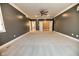 Main bedroom with carpet, ceiling fan and walk-in closet at 808 Copperfield Xing, Danville, IN 46122
