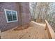 Brick home with wooden deck and a gas grill at 808 Copperfield Xing, Danville, IN 46122