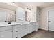 Double vanity bathroom with white cabinets and neutral flooring at 16703 Ayshire Dr, Fishers, IN 46037