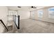 Bright bonus room featuring a carpeted floor and a staircase at 16703 Ayshire Dr, Fishers, IN 46037