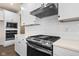 Stainless steel range and microwave in a white kitchen at 16703 Ayshire Dr, Fishers, IN 46037