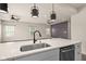 Modern kitchen with stainless steel appliances and quartz countertops at 16703 Ayshire Dr, Fishers, IN 46037