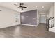 Spacious living room with hardwood floors and a purple accent wall at 16703 Ayshire Dr, Fishers, IN 46037