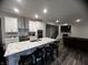 Modern kitchen with white cabinets, marble countertops, and island at 3609 Merchmont Rd, Bargersville, IN 46106