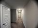 Long hallway with neutral colored walls and carpet at 3609 Merchmont Rd, Bargersville, IN 46106