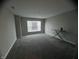 Simple bedroom with grey carpet and a window at 3609 Merchmont Rd, Bargersville, IN 46106
