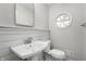 Clean bathroom with pedestal sink and round window at 1325 Alimingo Dr, Indianapolis, IN 46260