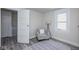 Spacious bedroom with a comfortable armchair and lots of natural light at 2641 Guilford Ave, Indianapolis, IN 46205