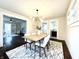 Bright dining room with wood floors and modern chandelier at 2641 Guilford Ave, Indianapolis, IN 46205