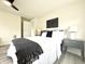 Main bedroom with a ceiling fan, bed, and lots of closet space at 2641 Guilford Ave, Indianapolis, IN 46205