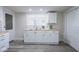 Bright kitchen featuring white cabinets, butcher block countertops, and stainless steel sink at 2641 Guilford Ave, Indianapolis, IN 46205