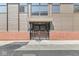 Modern building entrance with glass doors and brick base at 1521 N Alabama St # L, Indianapolis, IN 46202