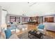 Open living room and kitchen with hardwood floors at 1521 N Alabama St # L, Indianapolis, IN 46202