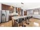 Modern kitchen with stainless steel appliances and granite island at 1521 N Alabama St # L, Indianapolis, IN 46202