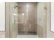 Spacious walk-in shower with glass enclosure and mosaic tile at 1521 N Alabama St # L, Indianapolis, IN 46202