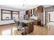Modern kitchen with granite countertops and dark wood cabinets at 1521 N Alabama St # L, Indianapolis, IN 46202