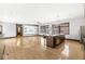 Spacious living room with hardwood floors and an island kitchen at 1521 N Alabama St # L, Indianapolis, IN 46202