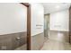 Modern bathroom with double sinks, shower, and tile flooring at 1521 N Alabama St # L, Indianapolis, IN 46202