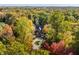 Aerial view of home showcasing a circular driveway and autumn landscaping at 9468 Sullivan Pl, Zionsville, IN 46077