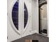 Modern basement entry with unique doors and a convenient elevator at 9468 Sullivan Pl, Zionsville, IN 46077