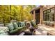 Relaxing back patio with comfortable seating and beautiful fall foliage views at 9468 Sullivan Pl, Zionsville, IN 46077