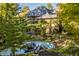 View of a house from behind with pond and bridge at 9468 Sullivan Pl, Zionsville, IN 46077