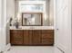 Elegant bathroom boasts a modern vanity, large mirror, and stylish light fixtures at 9468 Sullivan Pl, Zionsville, IN 46077