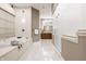 Luxurious bathroom with a large soaking tub, walk-in shower, and modern vanity at 9468 Sullivan Pl, Zionsville, IN 46077